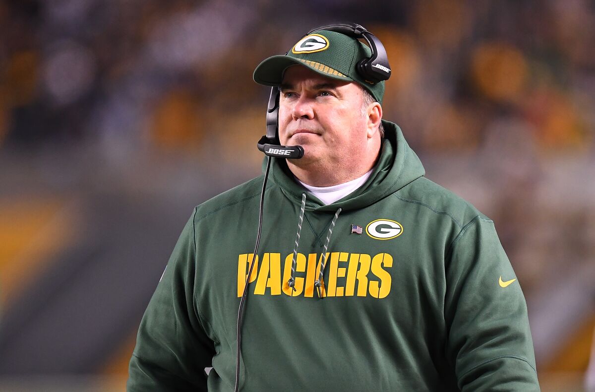 Mike McCarthy patrols the Green Bay Packers sideline as their head coach.
