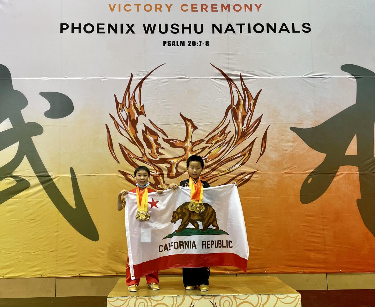 Brothers Alexander He (right) and Aaron He (left) won three championships each at the 2021 Phoenix Wushu Nationals.