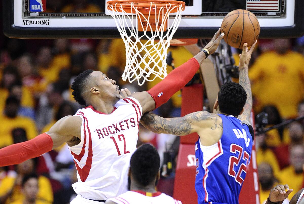 Houston center Dwight Howard blocks a shot from Matt Barnes during the Clippers' Game 5 loss to the Rockets, 124-103.