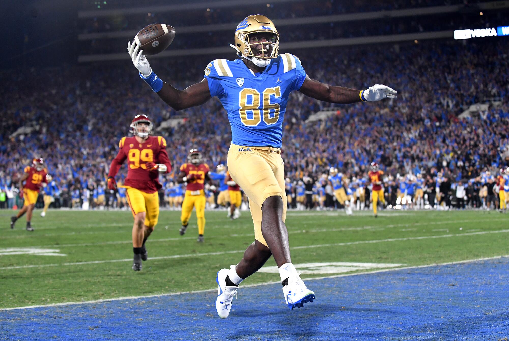 UCLA tight end Michael Ezeike celebrates a touchdown catch during the first quarter.