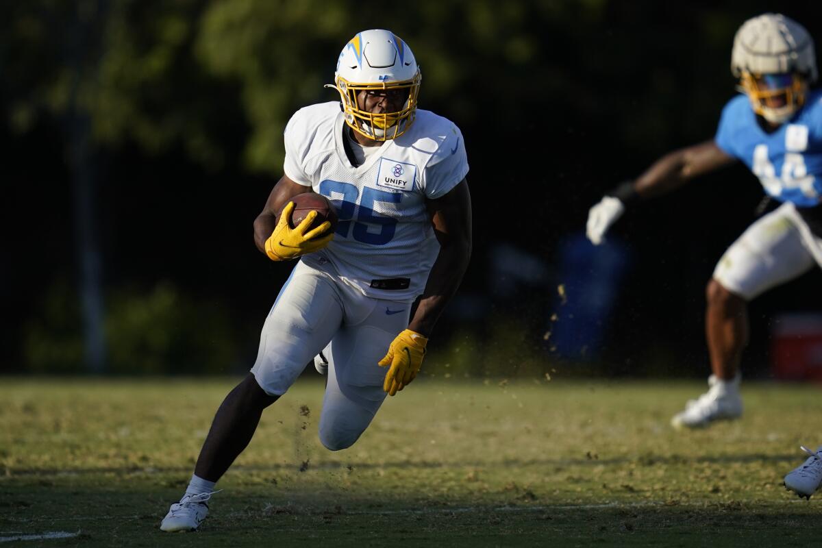 Chargers running back Joshua Kelley (25) cuts upfield during practice.