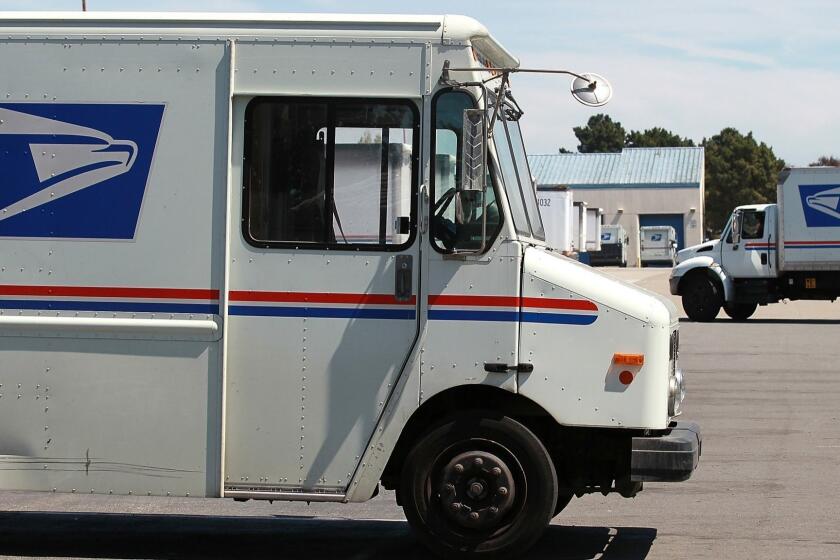 SAN FRANCISCO, CA - AUGUST 12: U.S. Postal Service trucks are seen parked near the loading dock at the U.S. Post Office sort center on August 12, 2011 in San Francisco, California. The U.S. Postal Service is proposing to lay off 120,000 workers in order to deal with an $8.5 billion loss this year that has the agency close to insolvency. The layoffs, if approved by Congress, would take place over the next three years. In addition to layoffs, the Postal Service also wants to eliminate 100,000 jobs through attrition. (Photo by Justin Sullivan/Getty Images) ** TCN OUT ** ORG XMIT: 5O3EQG9E