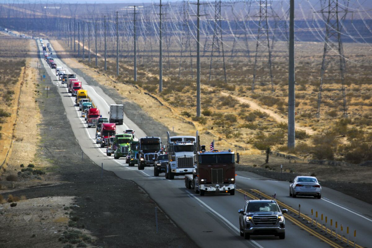 A convoy of truckers and others vehicles on a highway