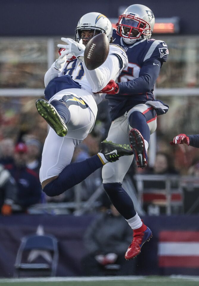 New England Patriots defensive back Devin McCourty knocks the ball from Chargers receiver Mike Williams during first half action in the NFL AFC Divisional Playoff at Gillette Stadium.