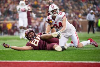 MINNEAPOLIS, MN - NOVEMBER 25: Wisconsin Badgers safety Hunter Wohler (24) gets a penally for interfering with Minnesota Golden Gophers tight end Brevyn Spann-Ford (88) during the college football game between the Wisconsin Badgers and the Minnesota Golden Gophers on November 25th, 2023, at Huntington Bank Stadium in Minneapolis, MN. (Photo by Bailey Hillesheim/Icon Sportswire via Getty Images)