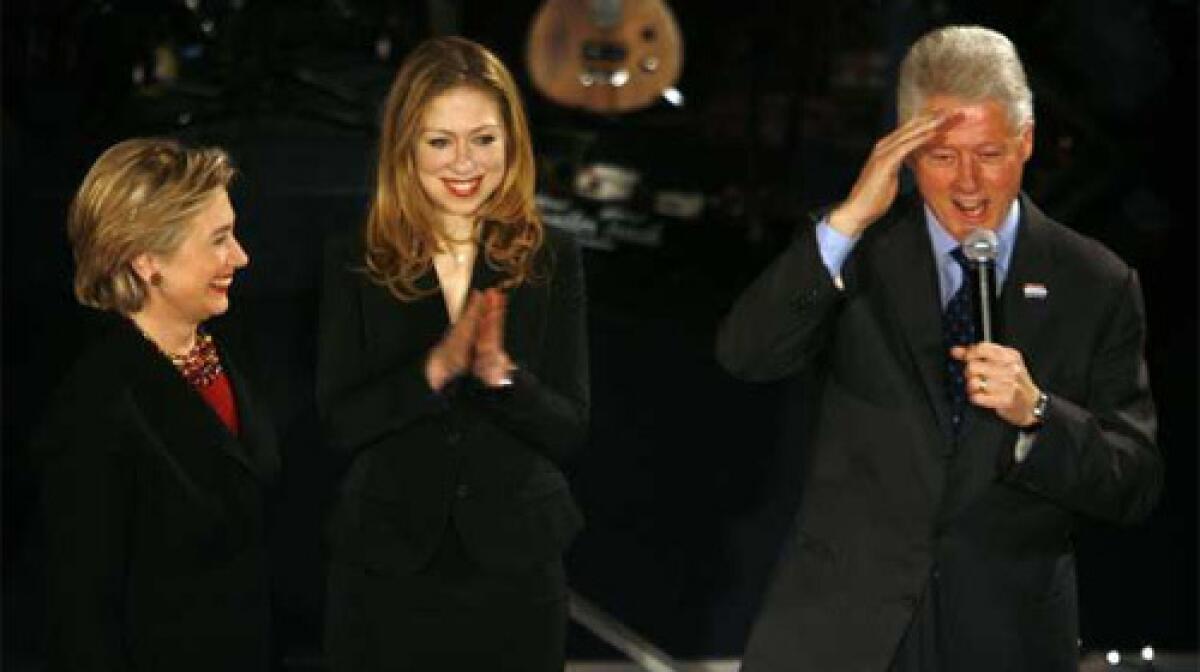 Democratic presidential candidate, Senator Hillary Clinton, is joined by her daughter, Chelsea, and husband, former President Bill Clinton, during a New Years Eve event at the Capitol Square in Downtown Des Moines, Iowa.