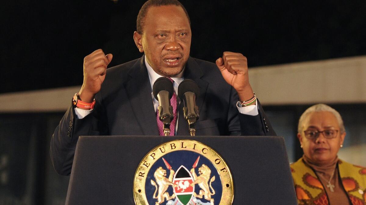 Kenya's President Uhuru Kenyatta speaks after the electoral commission's official announcement of the August election results, which were annulled by the Supreme Court.