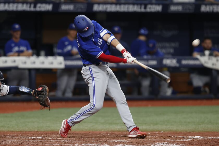 Toronto Blue Jays' Whit Merrifield hits a three-run home run against the Tampa Bay Rays during the seventh inning of a baseball game Saturday, Sept. 24, 2022, in St. Petersburg, Fla. (AP Photo/Scott Audette)