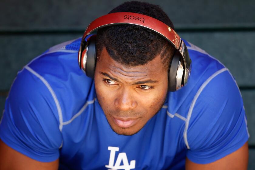Right fielder Yasiel Puig in the Dodgers dugout before a game against the Arizona Diamondbacks on April 12.