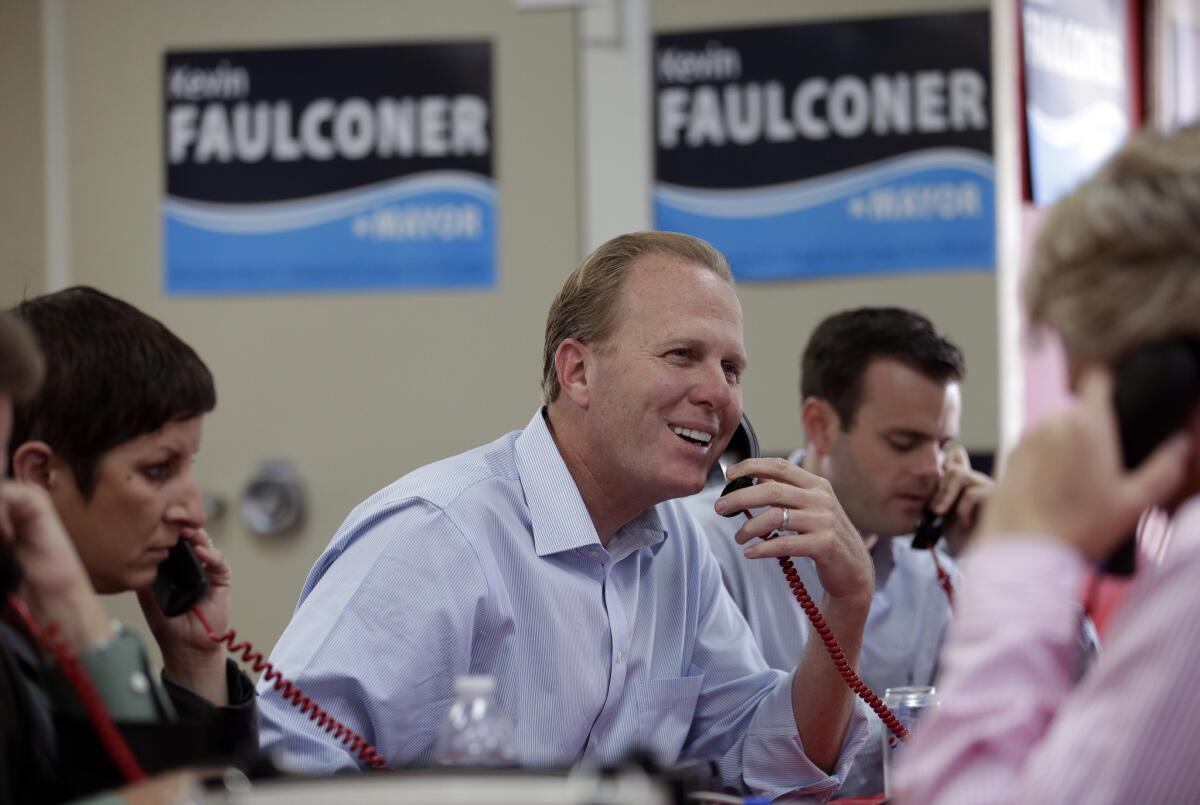 Councilman Kevin Faulconer makes phone calls to voters on mayoral election day in San Diego. He is the only Republican among the major candidates.