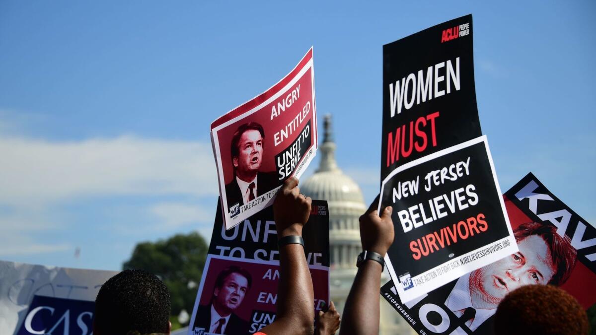 Demonstrators protest Supreme Court nominee Brett Kavanaugh in Washington on Oct. 4.