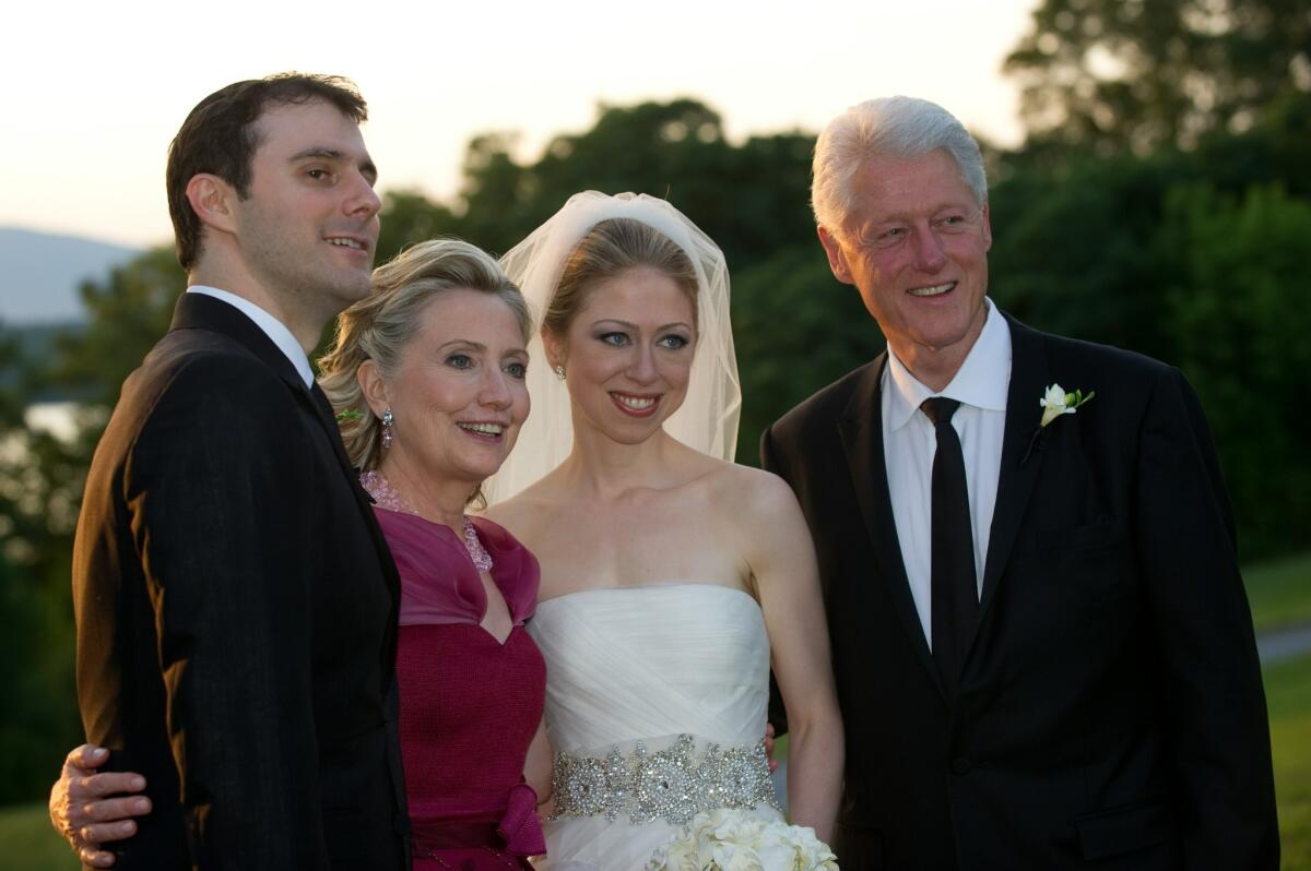 Former President Bill Clinton and former Secretary of State Hillary Clinton are pictured with Chelsea Clinton during her marriage ceremony with Marc Mezvinsky on July 31, 2010 in Rhinebeck, New York.