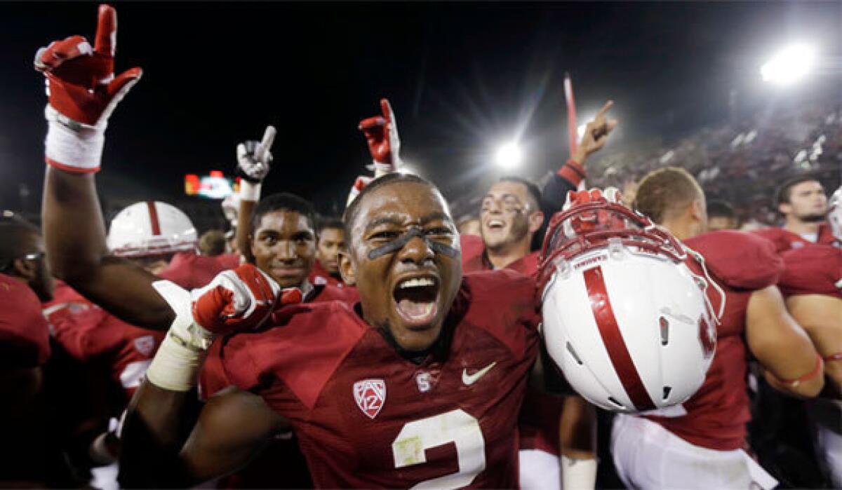 Stanford cornerback Wayne Lyons and his teammates celebrate after defeating USC on Sept. 15.