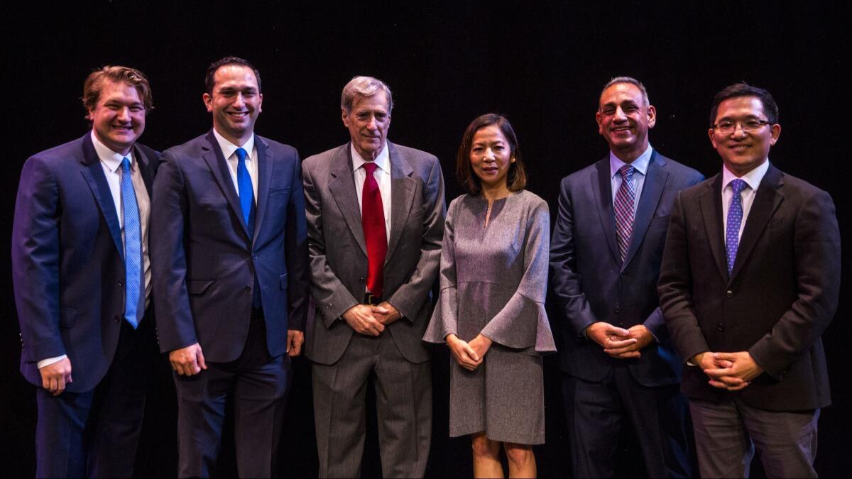 Phil Janowicz, Sam Jammal, Andy Thorburn, Mai-Khanh Tran, Gil Cisneros and Jay Chen at a forum for Democratic candidates in the 39th Congressional District in January. Janowicz and Chen have since dropped out.