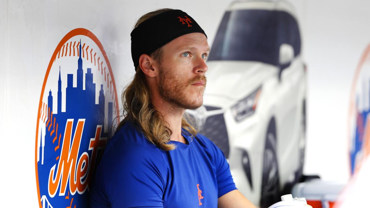 New York Mets pitcher Noah Syndergaard sits in the dugout during a game against the Atlanta Braves in July.