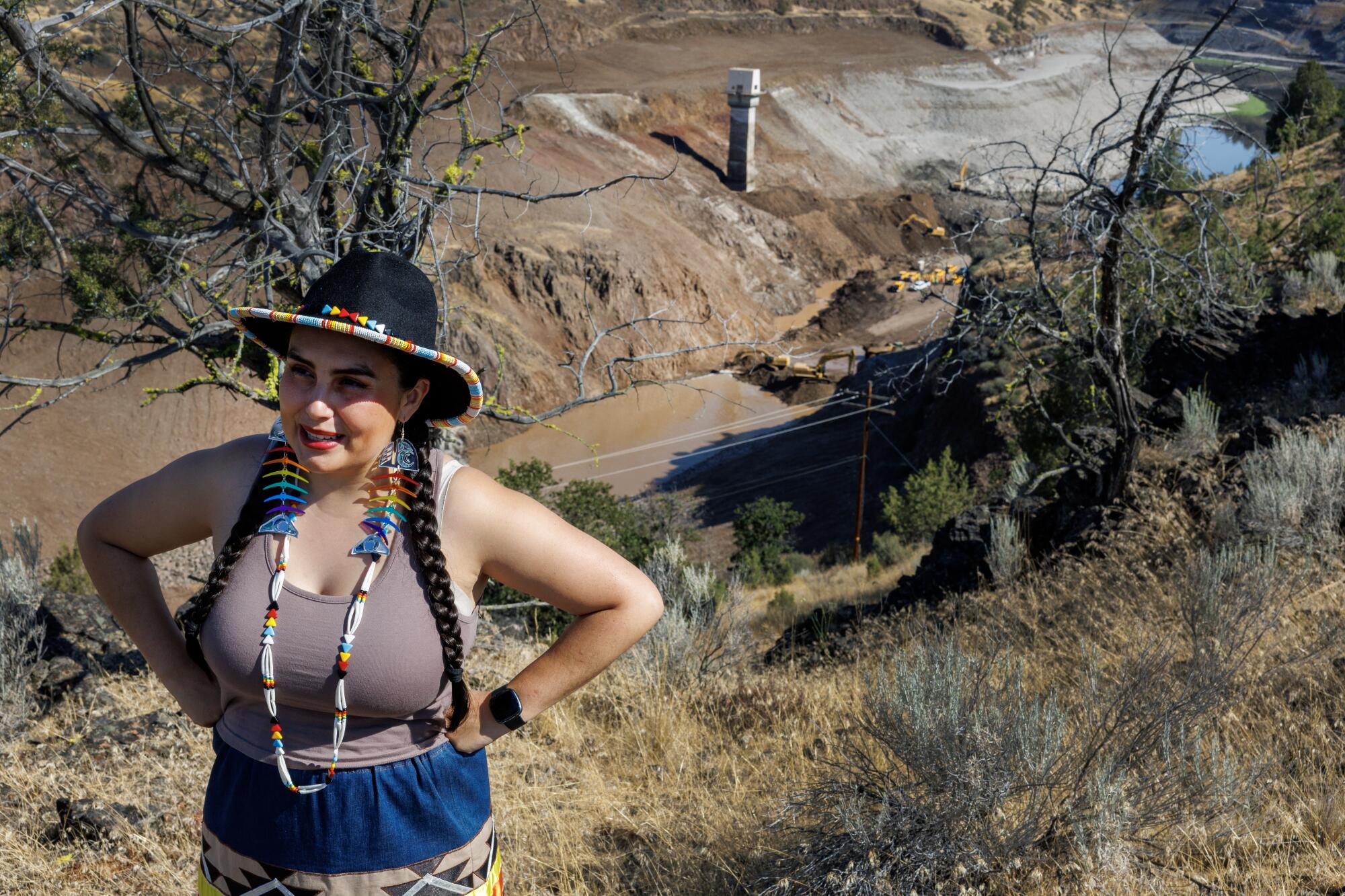 Brook Thompson of the Yurok Tribe stands above the removal site of the Iron Gate Dam.