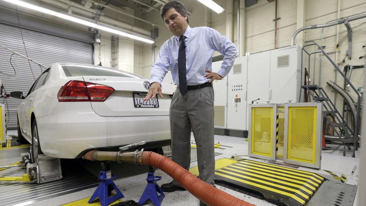 California Air Resources Board spokesman John Swanton shows how a Volkswagen Passat with a diesel engine is evaluated at an emissions test lab in El Monte in 2015.