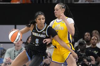Chicago Sky's Angel Reese (5) drives to the basket as Los Angeles Sparks' Dearica Hamby.