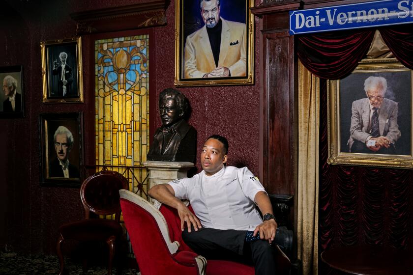 HOLLYWOOD, CALIFORNIA - June 11, 2019: The Magic Castle’s new executive chef Jason Fullilove poses for a portrait on Tuesday, June 11, 2019, underneath the portraits of famous magicians at the 55-year-old private club in Hollywood.