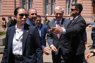 Surrounded by security, Chilean President-elect Jose Antonio Kast leaves the government house