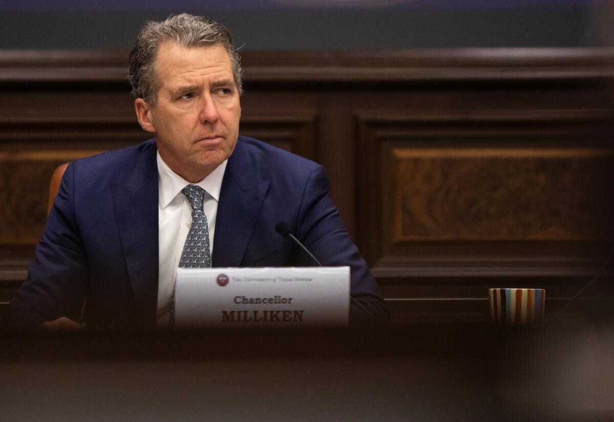 University of Texas Chancellor James B. Milliken sitting on the dais