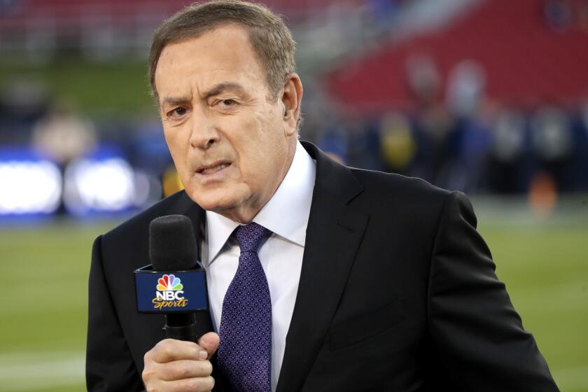 Al Michaels, play-by-play voice for NBC's Sunday Night Football, works on the sideline before an NFL game between the Los Angeles Rams and the Seattle Seahawks, Sunday, Dec. 8, 2019, in Los Angeles. Former ABC baseball commentator Al Michaels has been voted the Ford C. Frick Award for broadcast excellence by baseball’s Hall of Fame. Michaels, 76, will be honored during the Hall of Fame induction weekend in July.(AP Photo/Marcio Jose Sanchez)