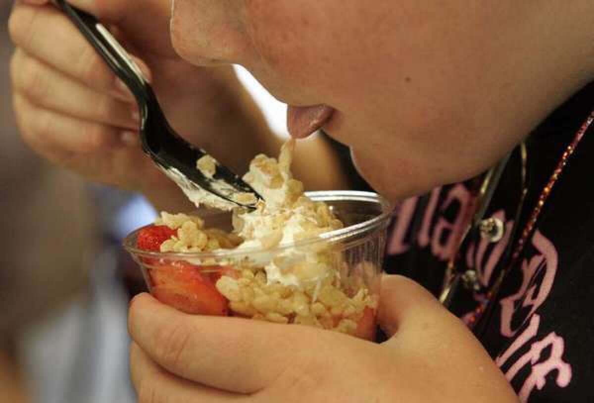 Talk to overweight kids about eating healthful foods, they're more likely to eat a healthful diet, says a new study. Talk to them about dieting, they're more likely to binge-eat and follow other self-defeating strategies to lose weight.