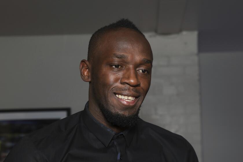 Athlete Usain Bolt poses for a photograph during an interview with the Associated Press prior to the launch of his new restaurant 'Tracks and Records', in London, Wednesday, Nov. 14, 2018. (Photo by Grant Pollard/Invision/AP)
