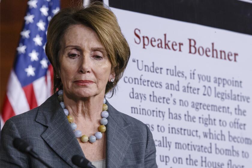 House Minority Leader Nancy Pelosi (D-San Francisco) attends a news conference at the Capitol.