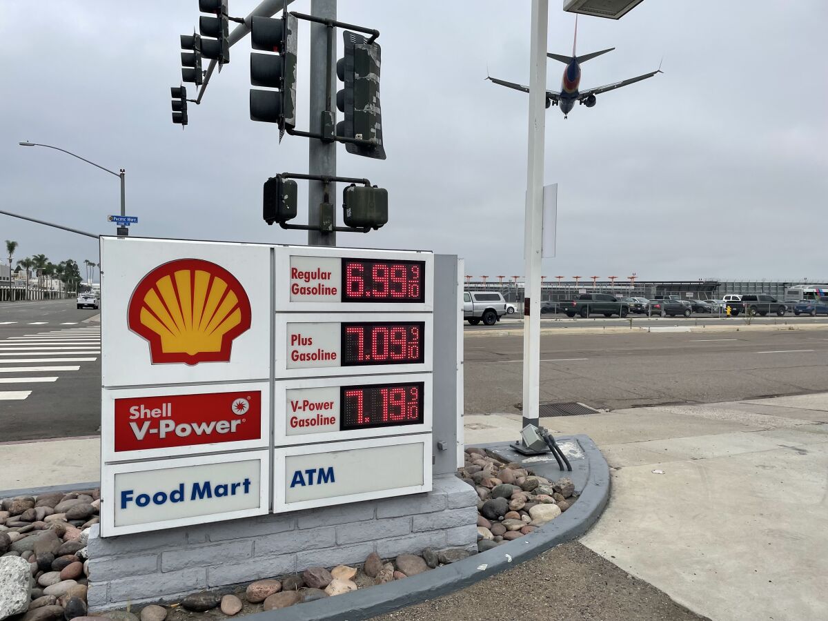 A sign at a Shell gas station displaying gas prices