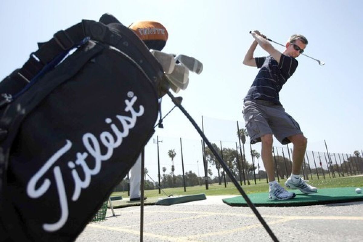 Michael Van Gorkom practices his swing at the driving range in Westchester. Other funemployed travel on the cheap for weeks, head back to school or volunteer.