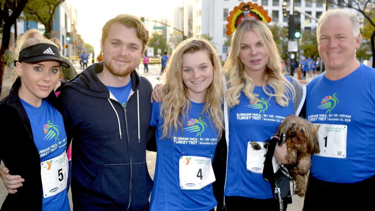 Among those who trotted on Turkey Day to benefit the YMCA were Michael, from right, Caroline, and her dog, Nobu, Taylor and Tanner Cusumano, joined by Kelsey DeMeire.
