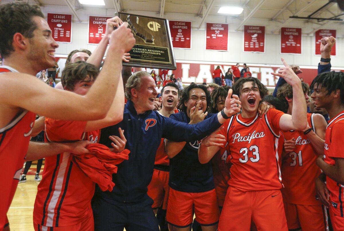 Pacifica Christian head coach Jeff Berokoff and team members celebrate.