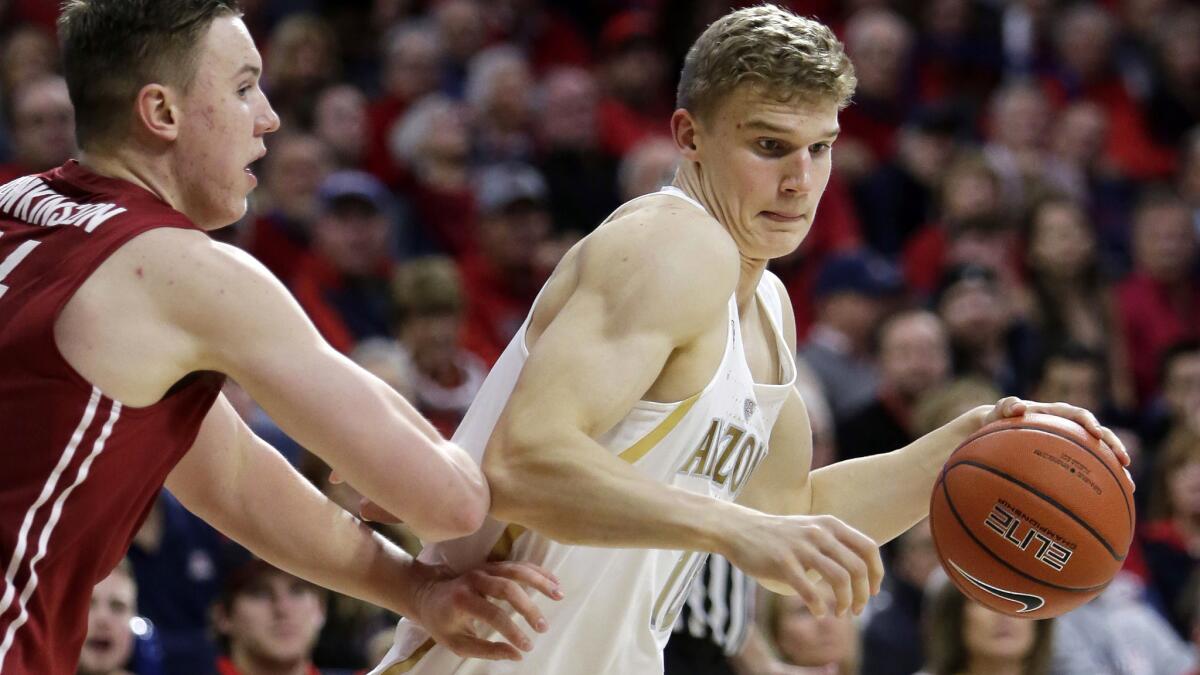 Arizona's Lauri Markkanen, shown driving during a game against Washington State, is a 7-foot freshman forward with the skills of a guard.
