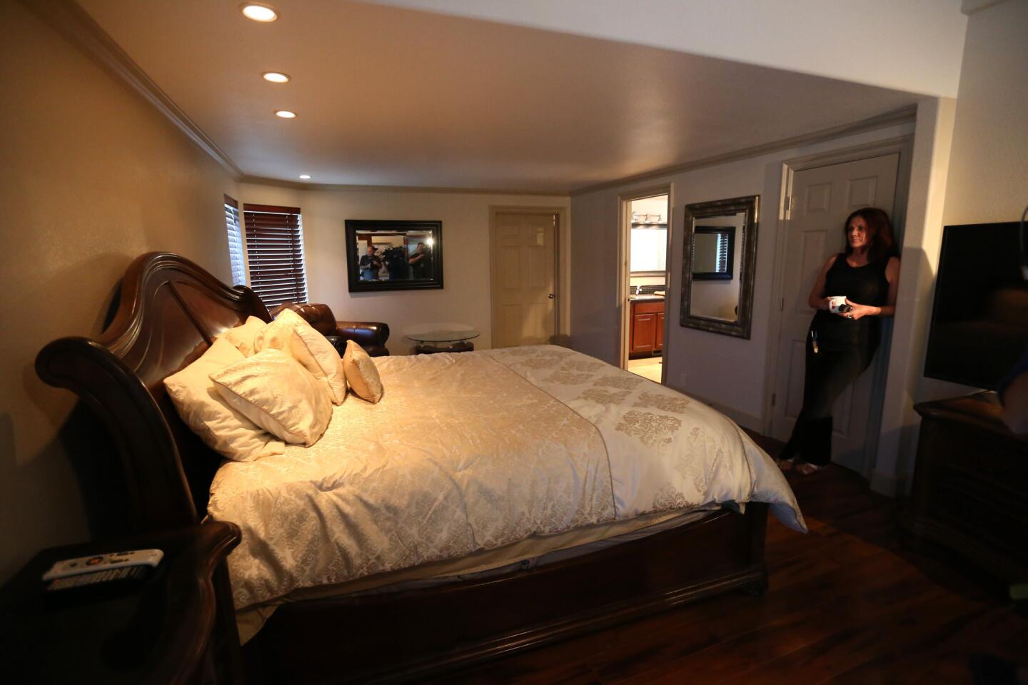 Lawanna, shift manager at Dennis Hof's Love Ranch, stands in the bedroom where NBA star Lamar Odom was found unconscious in Crystal, Nev.