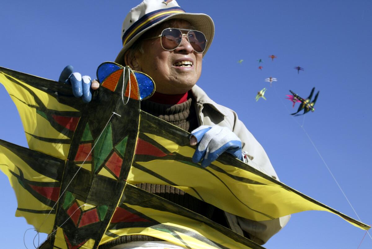 Artist Tyrus Wong, shown on Santa Monica Beach, at age 93 was designing and building kites, some more than 100 feet long.