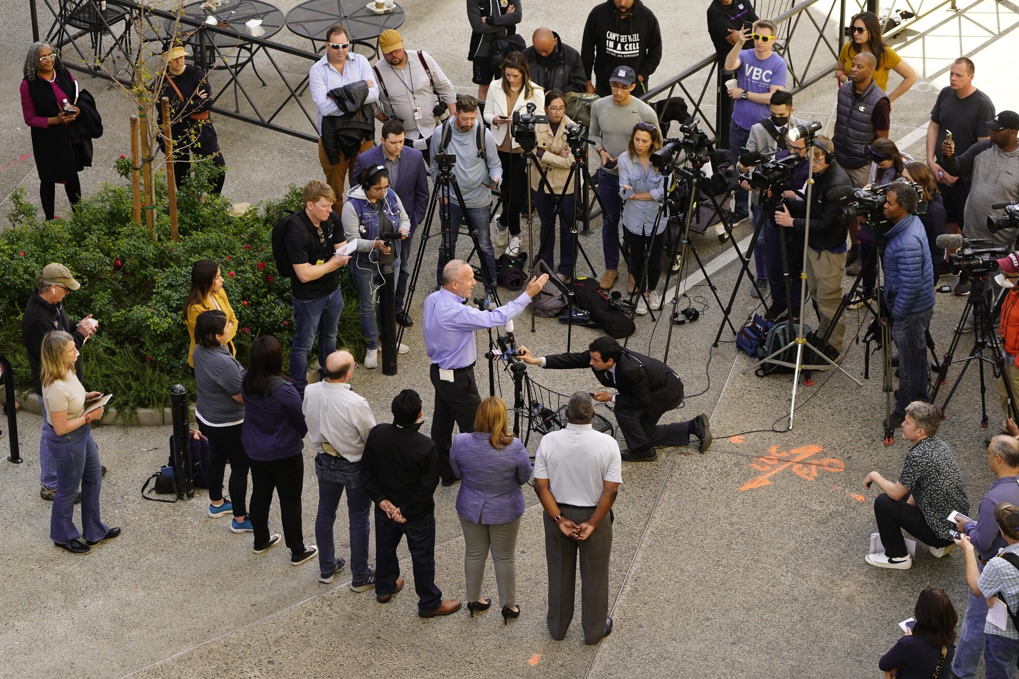 Sacramento Mayor Darrell Steinberg, center, talks to the media about the mass shooting In Sacramento, Calif.