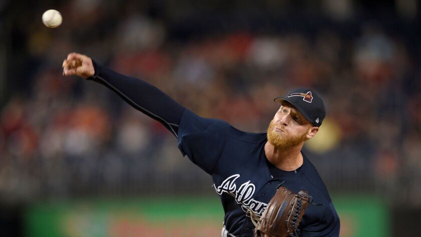 Atlanta Braves starting pitcher Mike Foltynewicz delivers a pitch during the first inning of a baseball game against the Washington Nationals in Washington. Foltynewicz went to salary arbitration with the Atlanta Braves.
