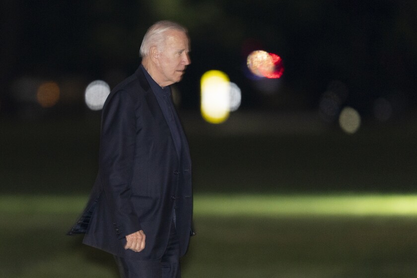President Joe Biden walks on the Ellipse near the White House in Washington, upon arrival from a trip to Europe, late Wednesday, June 16, 2021. (AP Photo/Manuel Balce Ceneta)