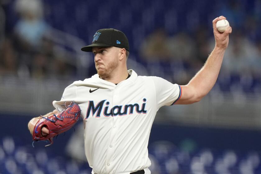Miami Marlins starting pitcher Trevor Rogers throws during the first inning of a baseball game against the Milwaukee Brewers, Tuesday, May 21, 2024, in Miami. (AP Photo/Lynne Sladky)