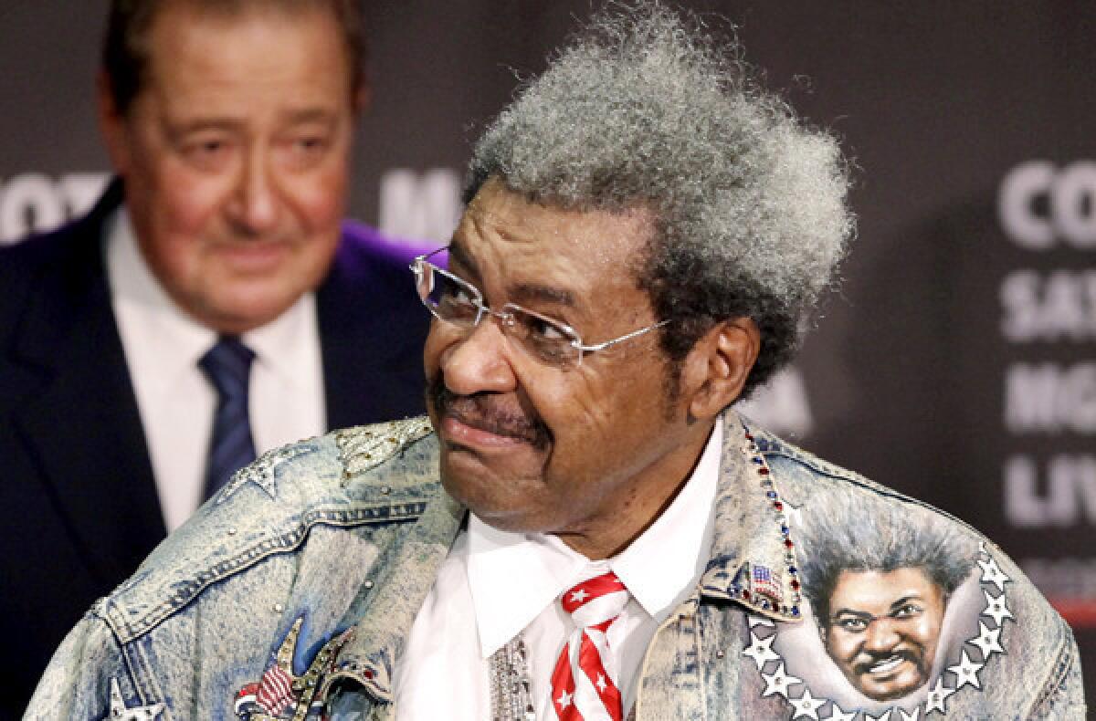 Don King, in front of fellow promoter Bob Arum during a news conference in 2011, is in Los Angeles currently promoting a May 10 heavyweight fight between Miami's Bermane Stiverne and Riverside's Chris Arreola.
