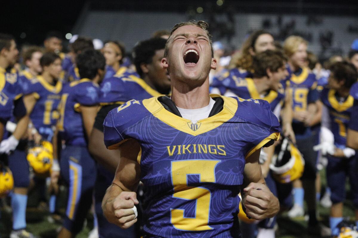 Ryder Malloy yells as Marina wins its first league title since 1986 by beating Segerstrom 25-14 in a Big 4 League game at Westminster High on Friday.