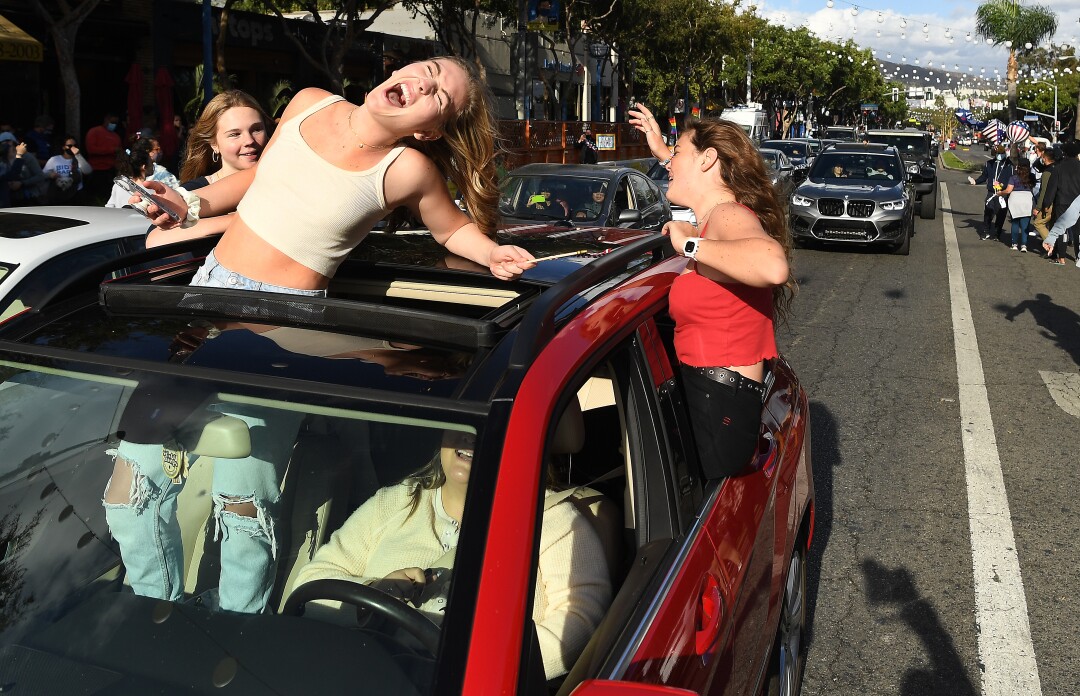 Motorists celebrate in West Hollywood on Saturday on the news of Joe Biden's victory.