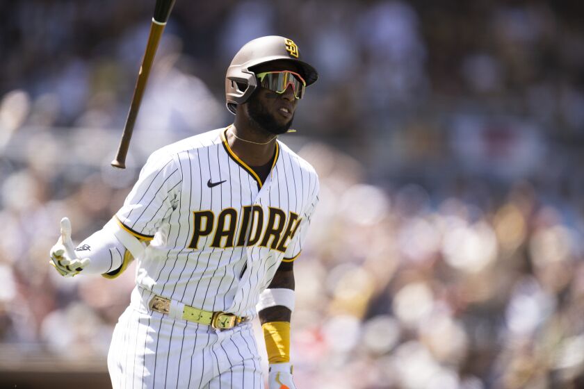 San Diego Padres' Jurickson Profar flips his bat after hitting a solo home run during the second inning of a baseball game against the Atlanta Braves in San Diego, Saturday, April 16, 2022. (AP Photo/Kyusung Gong)