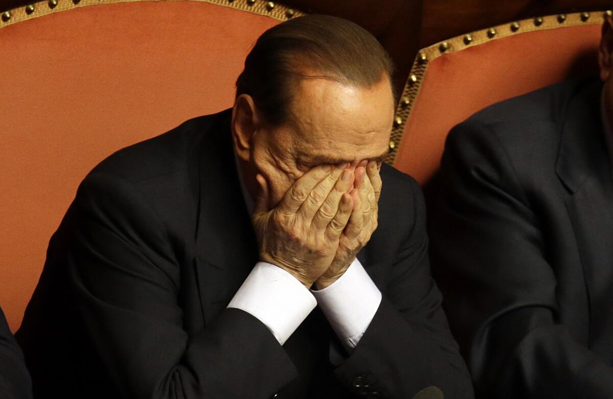 Silvio Berlusconi rubs his eyes after delivering a speech at the Italian Senate in Rome this week.