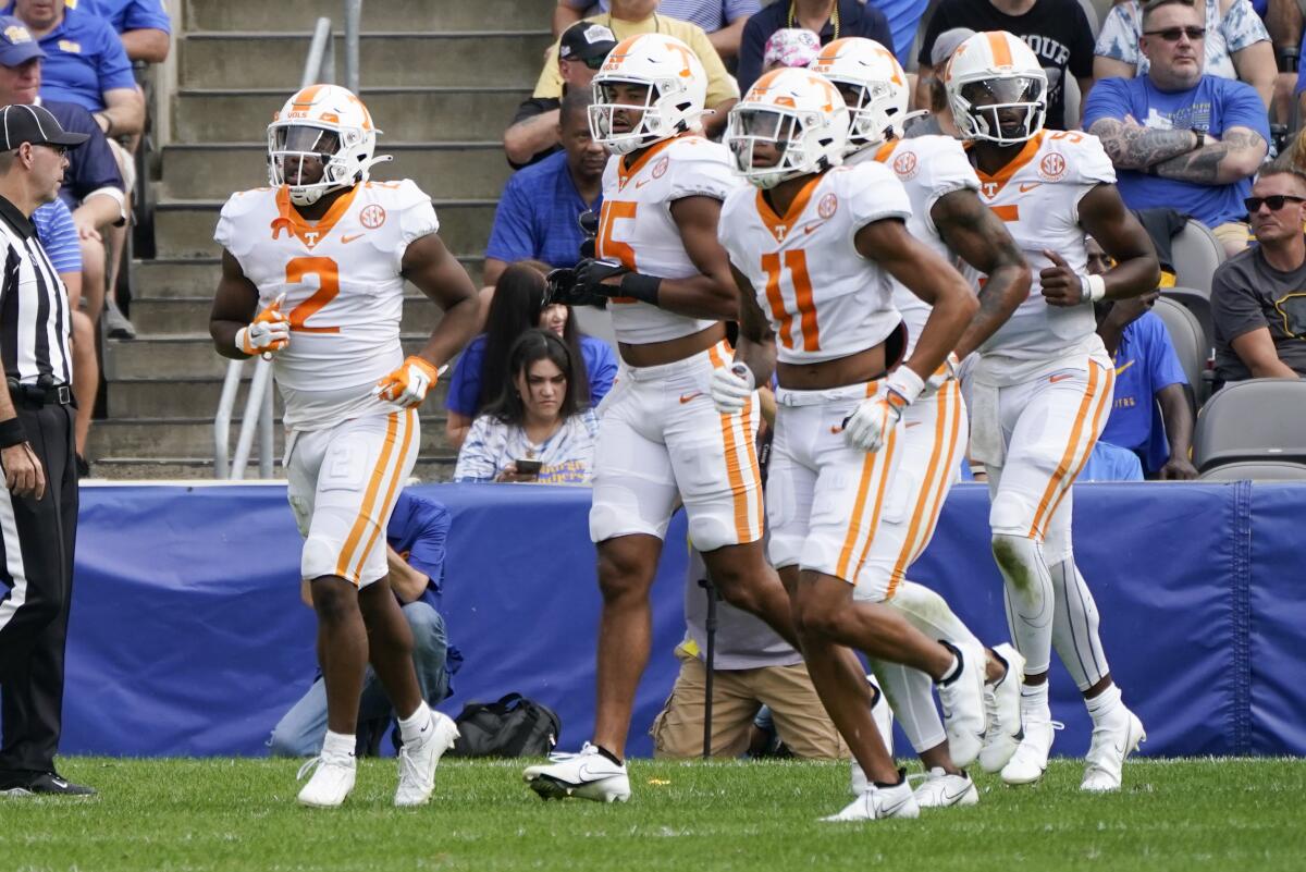 Tennessee running back Jabari Small (2), leads his team from the field after he scored a touchdown against Pittsburgh during the first half of an NCAA college football game, Saturday, Sept. 10, 2022, in Pittsburgh. (AP Photo/Keith Srakocic)
