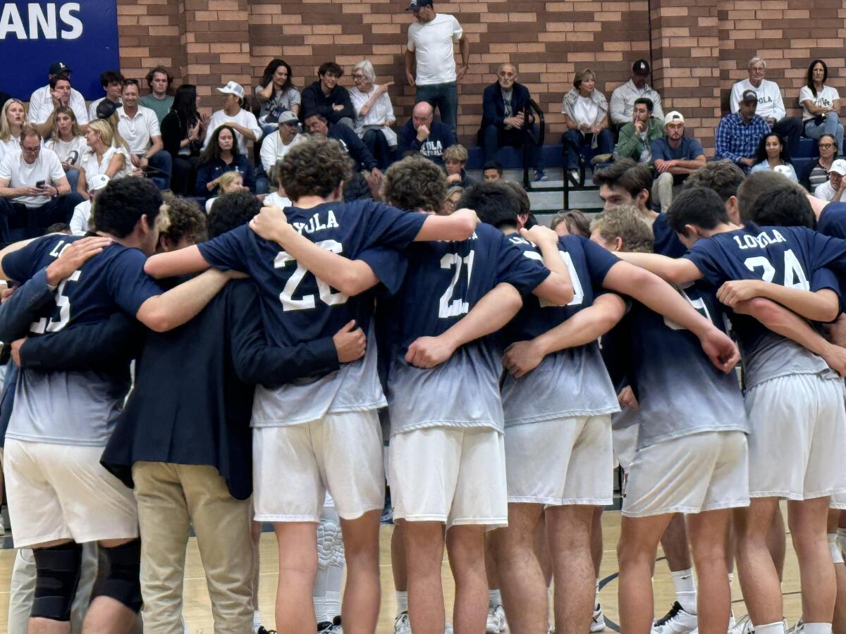 Loyola volleyball players gather on the court before defeating Newport Harbor 3-1 in the Division 1 semifinals on Saturday.