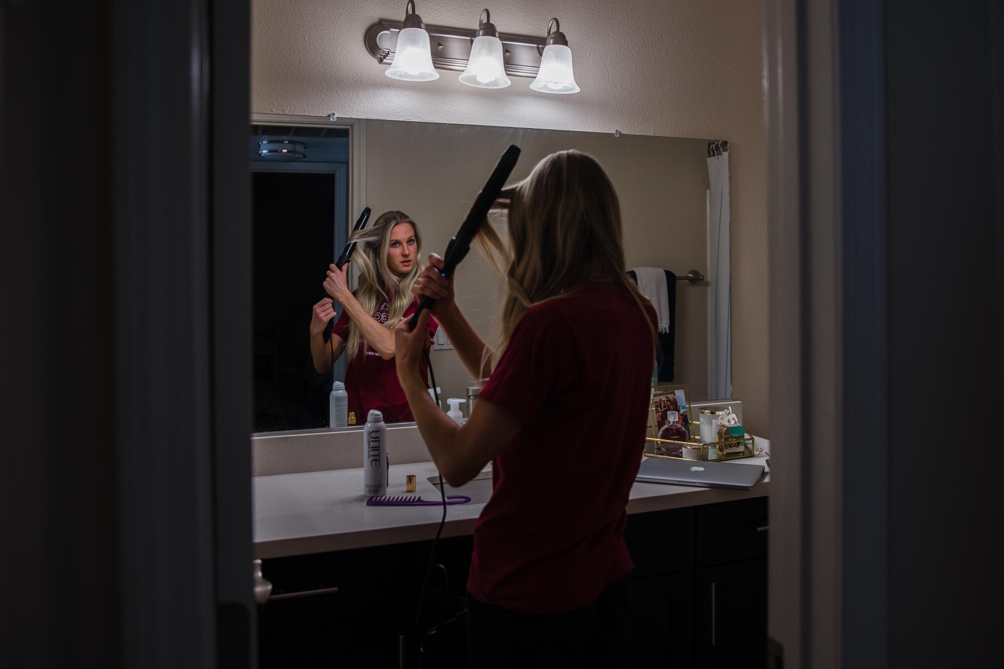 Rachael Lackner, 26, gets ready in her apartment in Mission Valley to go for acupuncture