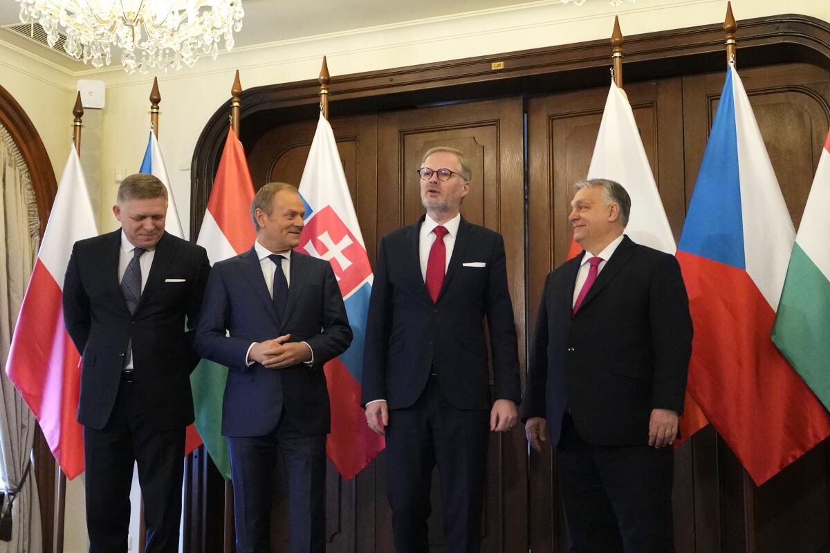 The prime ministers of Slovakia, Poland, Czech Republic and Hungary pose for a photo.