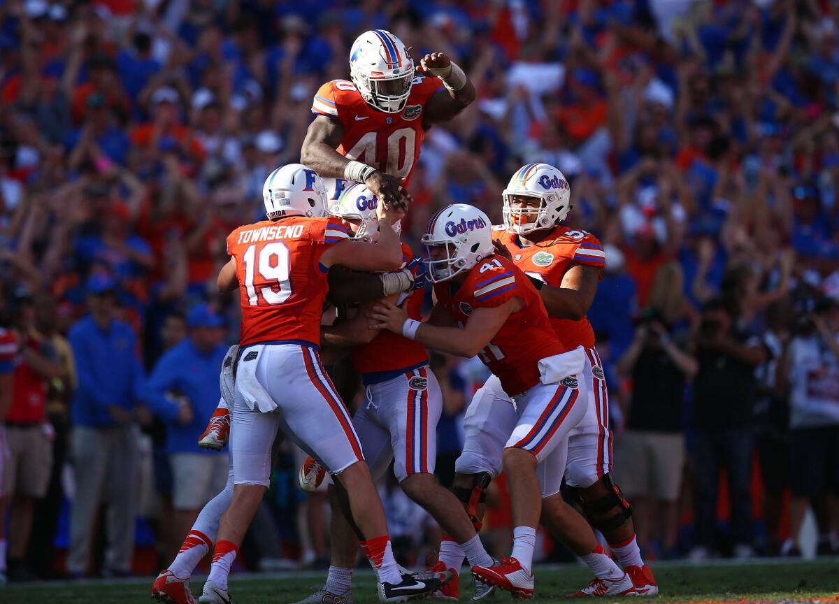 Florida Gators players celebrate with Austin Hardin (center) after he made the game-winning field goal during the fourth quarter of the game against Vanderbilt on Nov. 7.